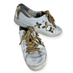 Michael Kors white leather tennis shoes with gold flowers, size 7.5